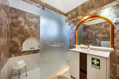 a bathroom with a shower with a toilet and a sink at Casa 54 in Valverde