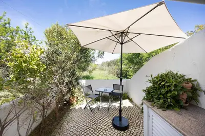 an open door of a house with a patio at Estúdio Agostinho in Luz