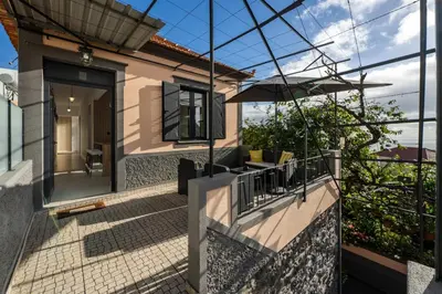a house with a view of a balcony at Casa Maria Bela 2-Bedroom with Terrace in Calheta