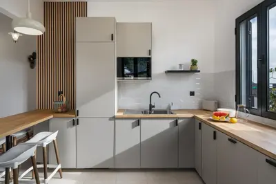 a kitchen with white cabinets and a sink at Casa Maria Bela 2-Bedroom with Terrace in Calheta