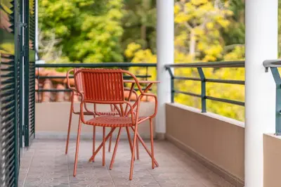 two chairs sitting on top of a balcony at GuestReady - Nature and tranquillity in Madeira in Gaula