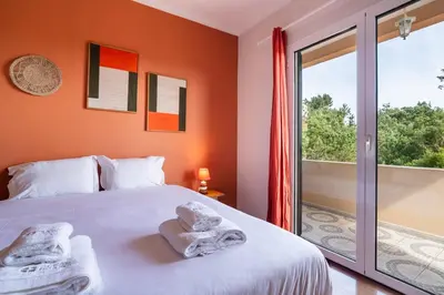a bedroom with a bed with towels on it at GuestReady - Nature and tranquillity in Madeira in Gaula