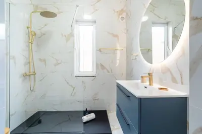 a bathroom with a sink and a mirror at GuestReady - Nature and tranquillity in Madeira in Gaula