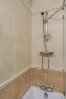 a shower in a bathroom with a bath tub at Casa da Areia, Three Bedroom Villa by the Beach in Luz