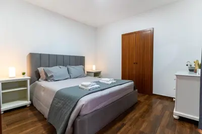 a shower with a glass door and a blue towel at Casa da Avo Belinha in Funchal