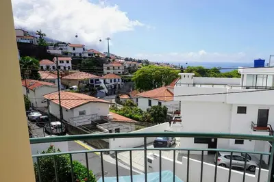 a view of a city from a balcony at !Your Home In Madeira in Funchal