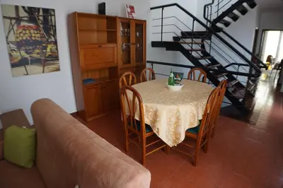 a living room with a table and a couch at !Your Home In Madeira in Funchal