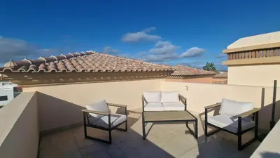 two chairs and a table on a balcony at Quinta da Atalaia - Seaview Townhouse with pool in Lagos