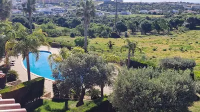an image of a swimming pool in a yard with trees at Quinta da Atalaia - Seaview Townhouse with pool in Lagos