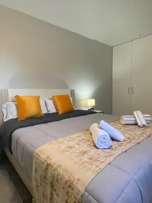 a bedroom with two beds with pillows on them at My little home cottage in Porto Moniz