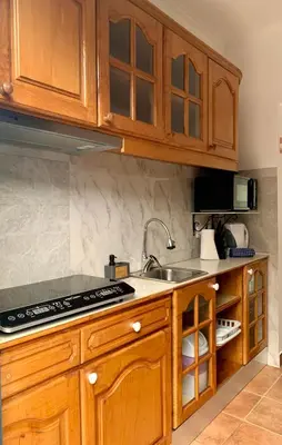 a white bathroom with a toilet and a shower at Seaside & Levada Escape in Machico