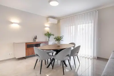 a living room with a couch and a table at Boavista Golf & Spa - Villa Paul at Bayview Village in Lagos