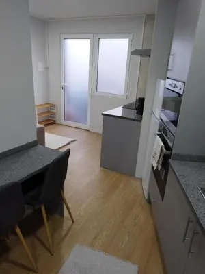 a kitchen with a counter top and a kitchen with a stove at charnecas house in Gaula