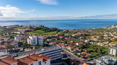an aerial view of a city and the ocean at Lux Mare Funchal by YOUR KEY MADEIRA in Funchal