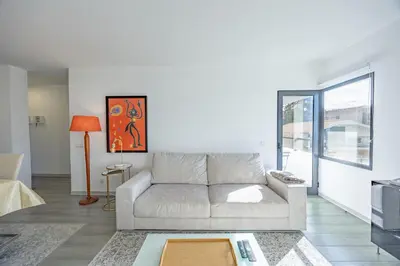a living room with a couch and a table at Lux Mare Funchal by YOUR KEY MADEIRA in Funchal