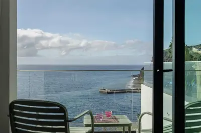 a view of the ocean from a balcony at Alma do mar luxury - Ocean front in Gaula