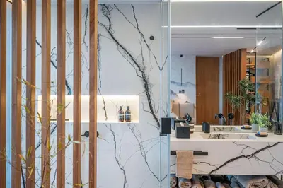 a bathroom with a glass wall with a mirror at Aurora Residence - Ultra Luxury Ocean Cliff Edge Retreat in Arco da Calheta