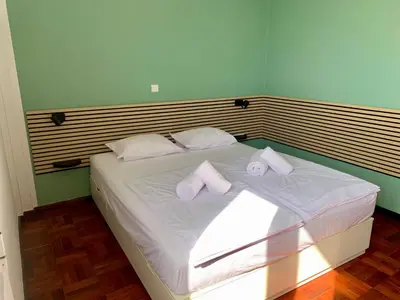 a bathroom with a toilet and a sink and a shower at Residencial do Vale in Funchal