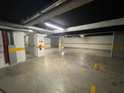 an empty parking garage with a fire hydrant in it at Atlantic Residence Pool & Ocean View in Câmara de Lobos