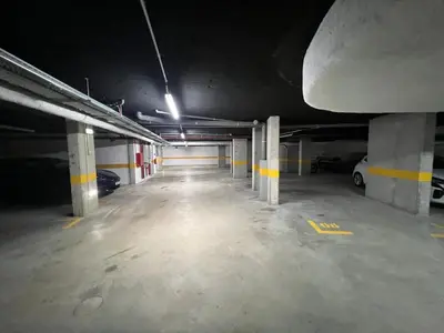 an empty parking garage with cars parked in it at Atlantic Residence Pool & Ocean View in Câmara de Lobos
