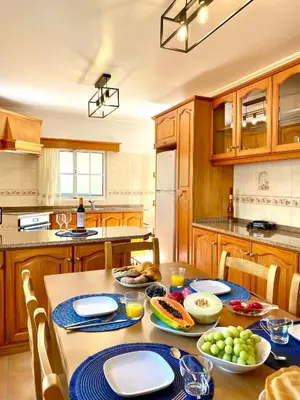 a kitchen with a table with food on it at 
