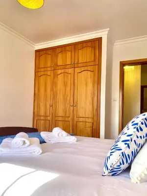 a bedroom with a bed with towels on it at 