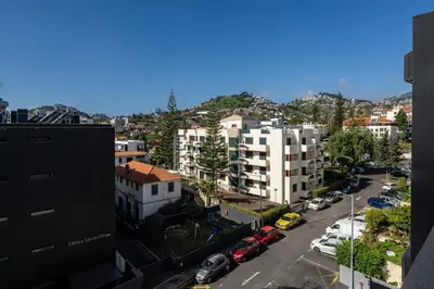 an aerial view of a city with buildings and cars at Stay Orange Modern Apartment in Funchal in Funchal