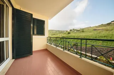 a picture of a newspaper on a wall at Ocean Gardens Apartment by Mth in Caniço