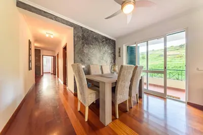 a kitchen with a stainless steel refrigerator and a dishwasher at Ocean Gardens Apartment by Mth in Caniço