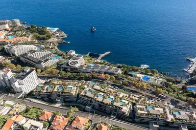 an aerial view of a city next to the water at Savoy Monumentalis XI Luxury with sea view in Funchal