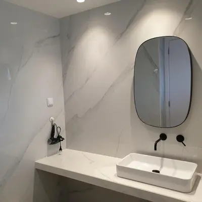 a white bathroom with a sink and a mirror at Pilot Ocean View in Funchal