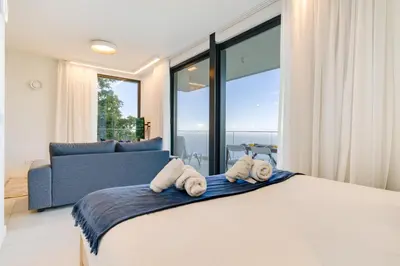 a bedroom with a bed with towels on it at Mar Yam Sea - Ocean View by Atlantic Holiday in Arco de São Jorge