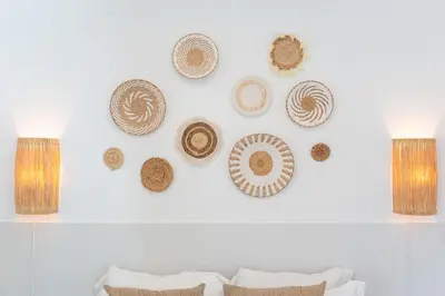 a group of hats hanging on a wall at Pátio da Luz 1Bdr House by LovelyStay in Luz