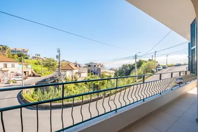 a balcony with a view of a street at Johns Villa by Homie in Canhas