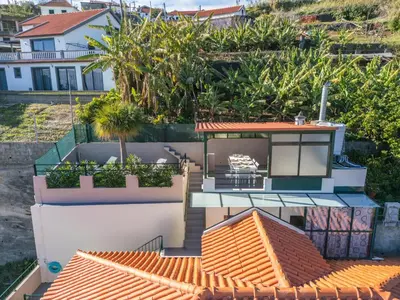 an aerial view of a house with an orange roof at Johns Villa by Homie in Canhas