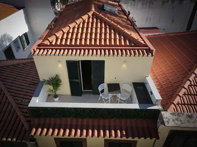 an overhead view of a house with a roof at Apartamentos Baptista by AnaLodges in Funchal