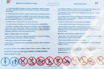 a page of a document with red and white signs at Atlantic Pearl Pool & Ocean View One Bedroom Apartment in Câmara de Lobos