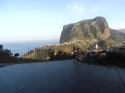 a balcony with a view of a mountain at Vivenda Fortim in Faial