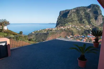 a balcony with a view of the ocean at Vivenda Fortim in Faial