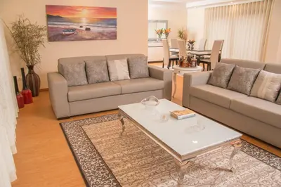 a living room with two couches and a coffee table at Vivenda Fortim in Faial