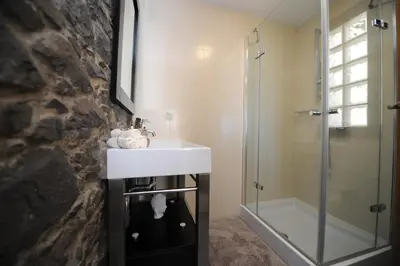 a bathroom with a sink and a shower at BHF Residences Bordadeira in Arco da Calheta