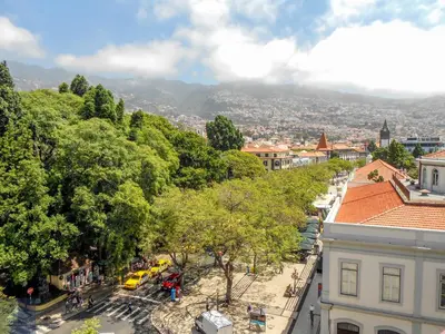 an overhead view of a city with trees and buildings at Arriaga Marina Club Apartament in Funchal