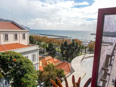 a view of the ocean from a building at Arriaga Marina Club Apartament in Funchal
