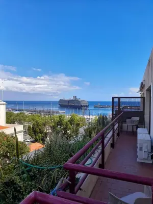 a balcony with a view of the ocean at Arriaga Marina Club Apartament in Funchal