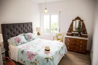a bedroom with a large bed with a hat on it at Apartment Serrão in Funchal