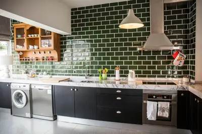 a kitchen with a sink and a washer and dryer at Apartment Serrão in Funchal