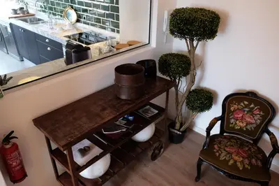 a room with a table and a chair and a window at Apartment Serrão in Funchal