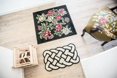 a table with a painting and a picture on the floor at Apartment Serrão in Funchal