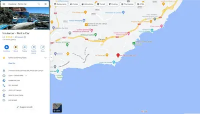 a screenshot of a google maps app and a phone screen at Ventur Flat in Caniço