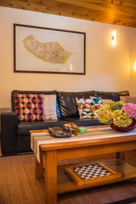 a living room with a couch and a coffee table at Villa Ricardo in Porto da Cruz